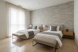 bedroom with modern design porcelain on floors with 2 single beds and stone cladding behind the beds