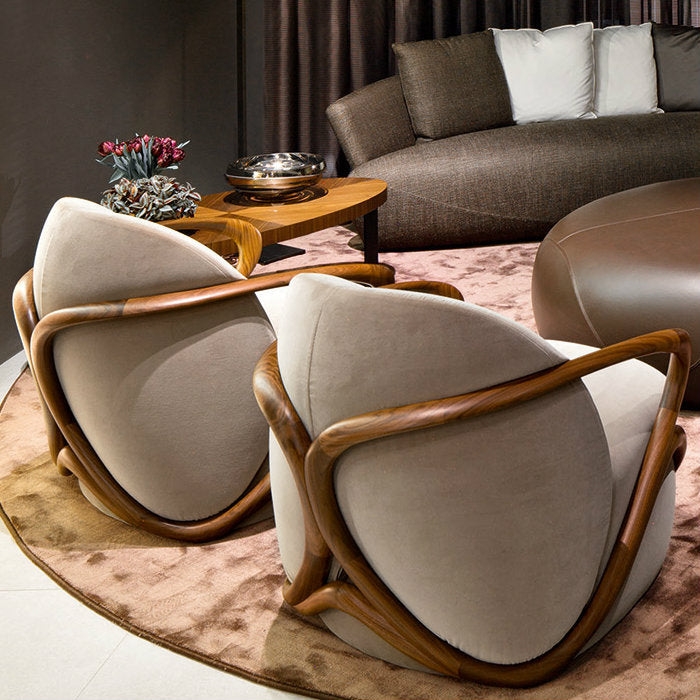 Modern living room with beige armchairs, wooden coffee table, and gray sofa.