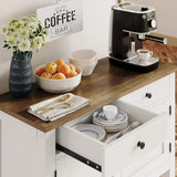 Kitchen counter with coffee machine, fruit bowl, and flowers in a vase.